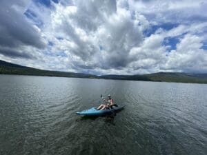 Denise Baum outside in a kayak.