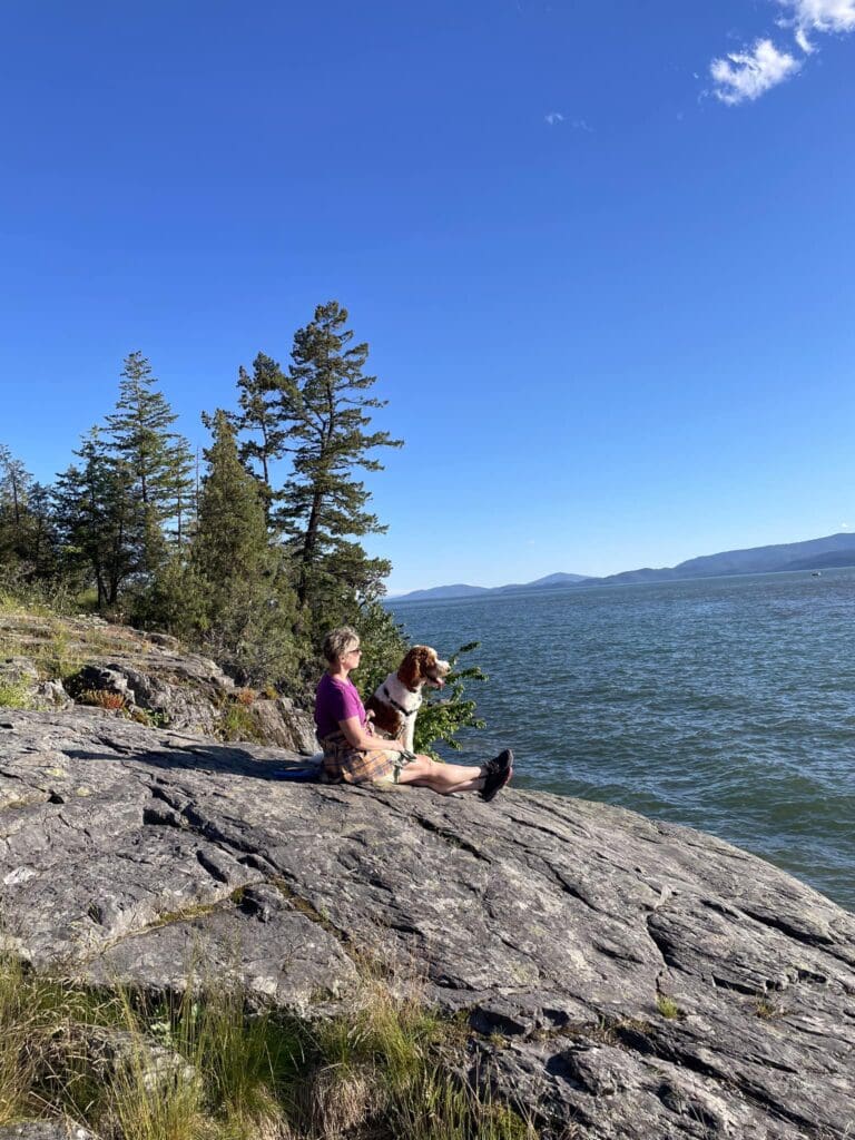 Denise Baum and her dog sitting outside